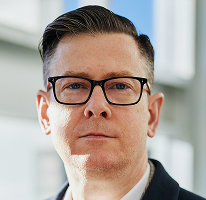 Geschäftsführer Alexander Hughes in einem Porträt des Kryptowährungshandelunternehmens